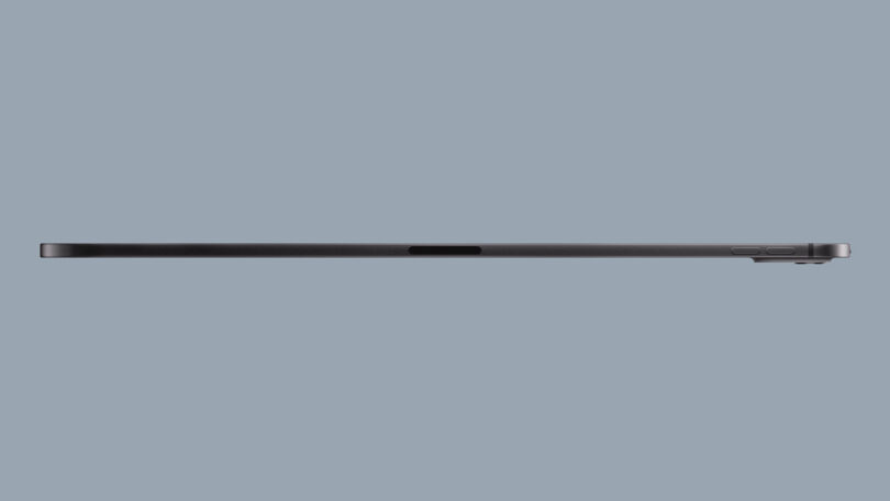 Side view of a thin, black Apple iPad Pro showing buttons on the right side and a camera bump on the upper-right corner.