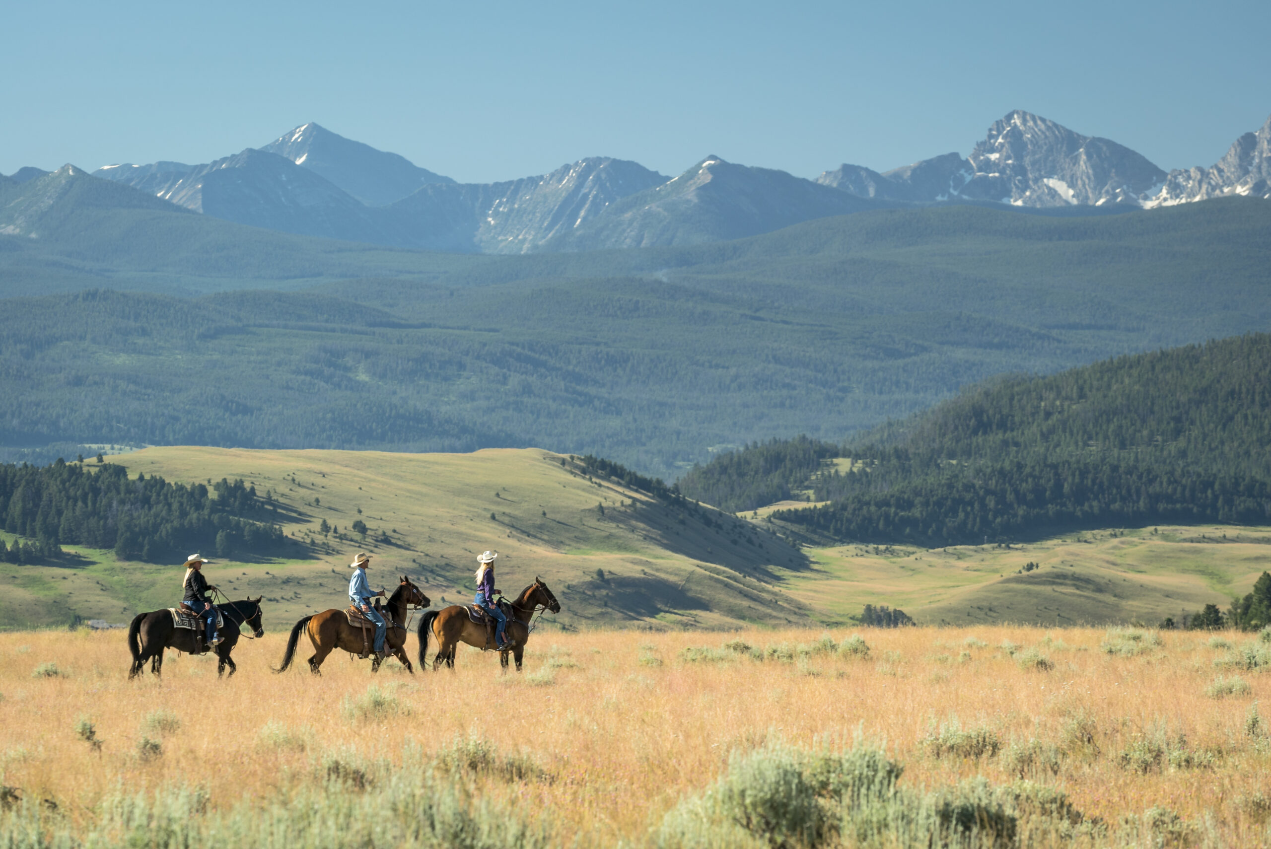 TRRC Fall Horseback Riding.JPG Three people on an autumn horseback ride at the Ranch at Rock Creek