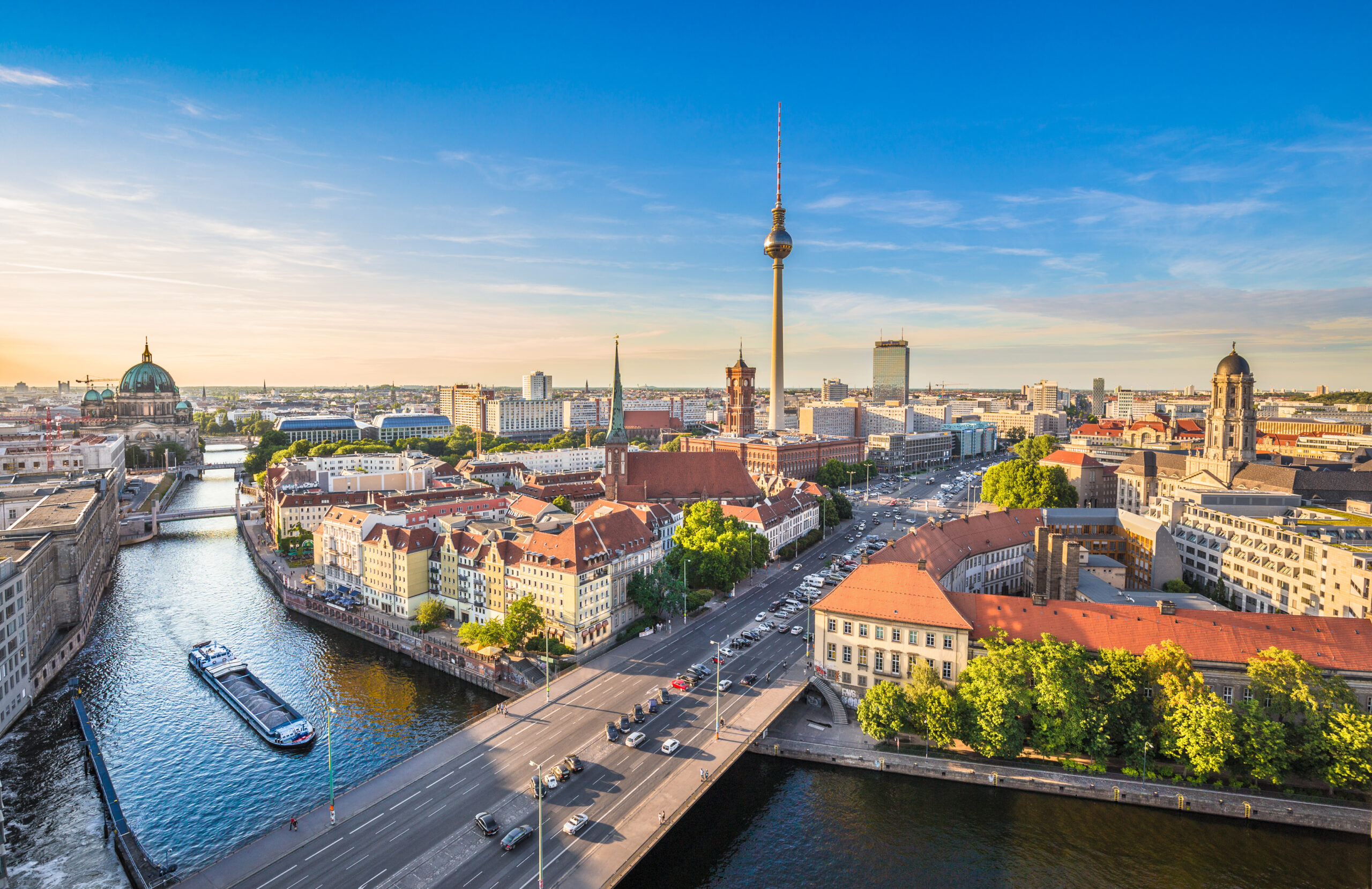 shutterstockRF337203833.jpg A cityscape and river with a tall TV tower in the center