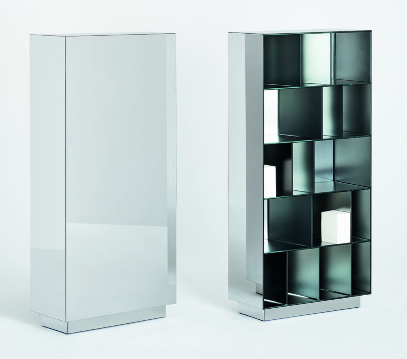 Modern metal storage unit with a geometric design featuring multiple square and rectangular compartments, positioned against a plain white background.