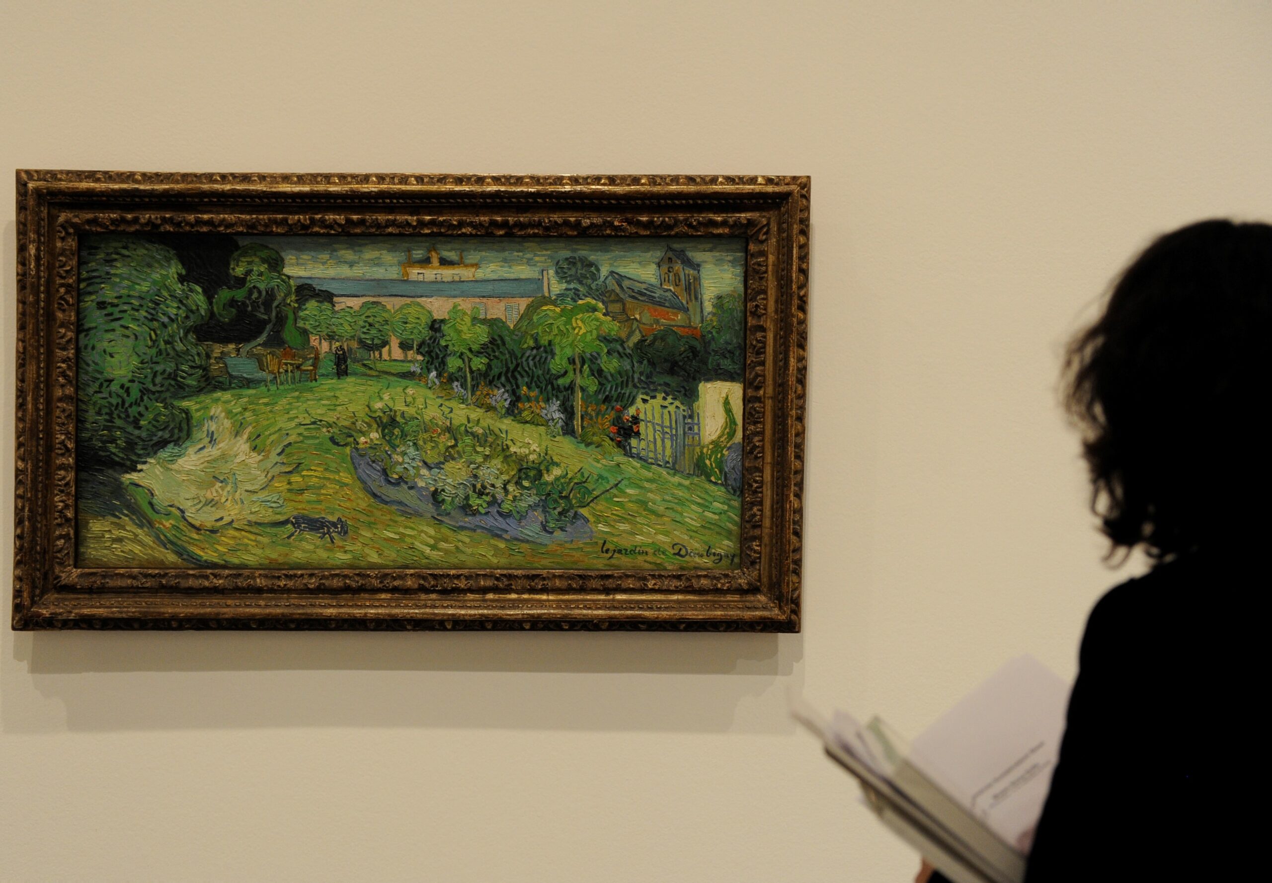 Kunstmuseum Basel Masterpieces at Prado and Reina Sofia Museum A visitor looks at the painting 'Le jardin de Daubigny' by Vincent van Gogh, which is on display at the Kunstmuseum Basel.